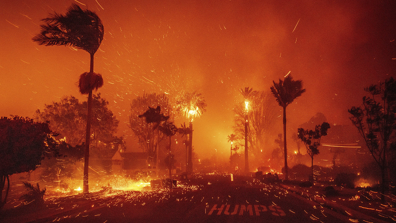 The Palisades Fire ravages a neighborhood amid high winds in the Pacific Palisades neighborhood of Los Angeles, Tuesday, Jan. 7, 2025.