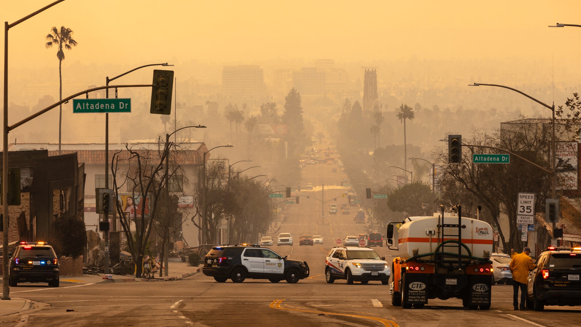 Smoke from the Eaton Fire blankets the air of Altadena, California, on January 9, 2025. Wildfires threatened to engulf parts of Hollywood on January 9 as a growing number of blazes raged across Los Angeles, forcing over 100,000 people to flee their homes and claiming at least five lives.