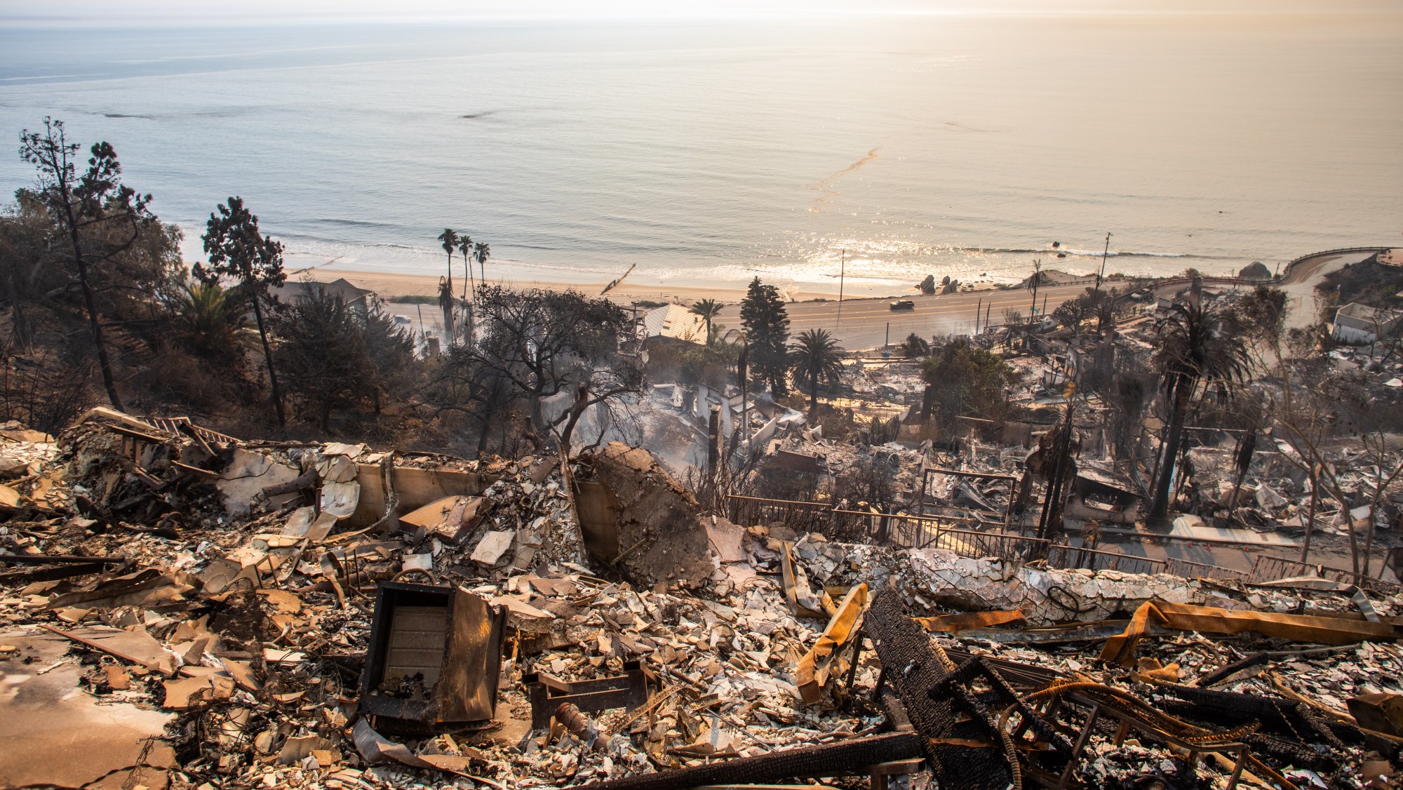 Burned houses are seen from the Palisades Fire on January 9, 2025 in the Pacific Palisades neighborhood of Los Angeles, California.