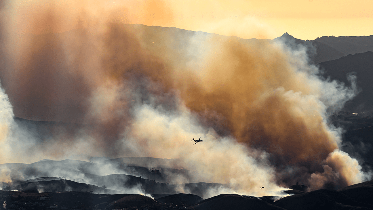 In this aerial view taken from a helicopter, an air tanker prepares to drop fire retardant on the Kenneth Fire in Calabasas on Jan. 9, 2025.