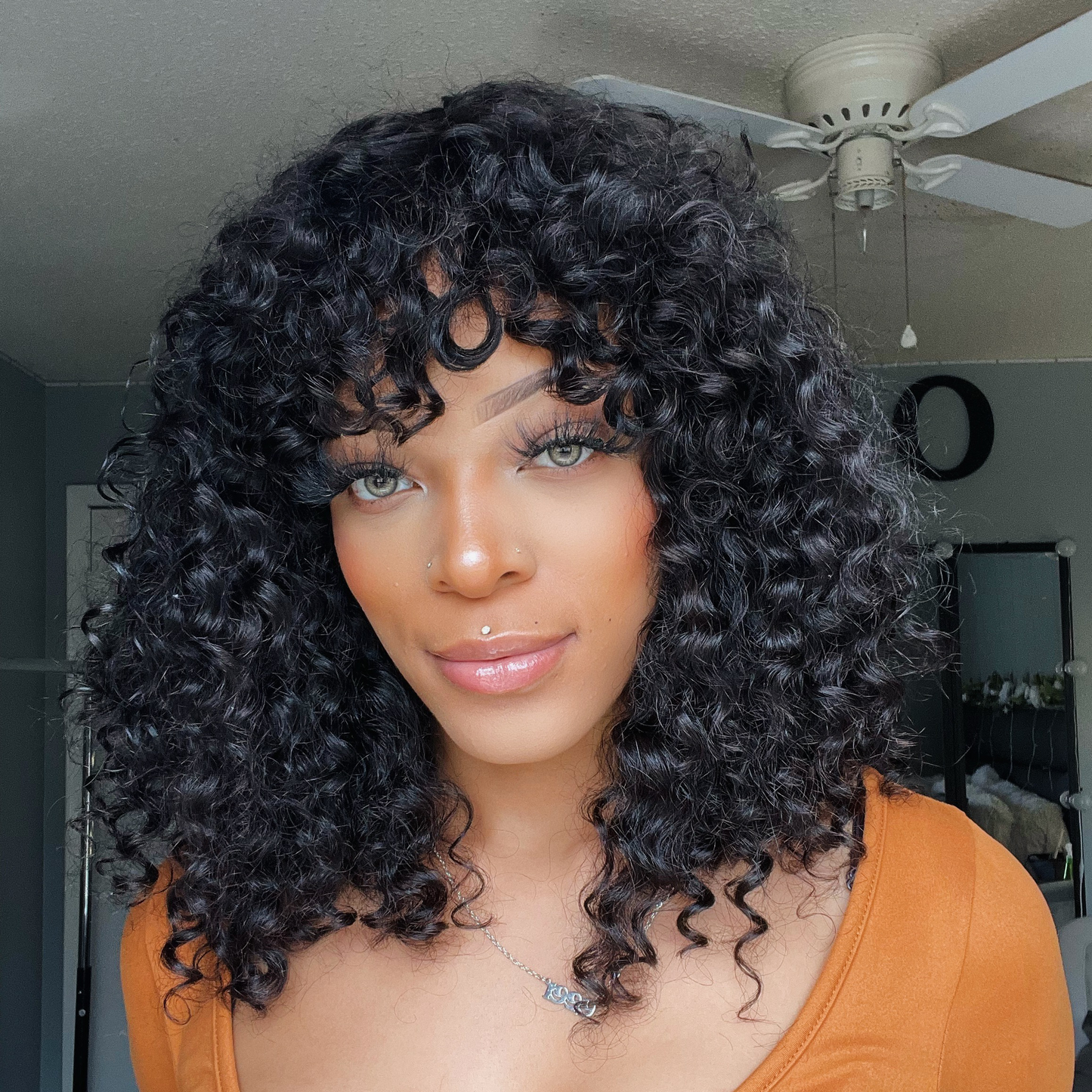 Shoulder-Grazing Curly Wig With Wispy Bangs